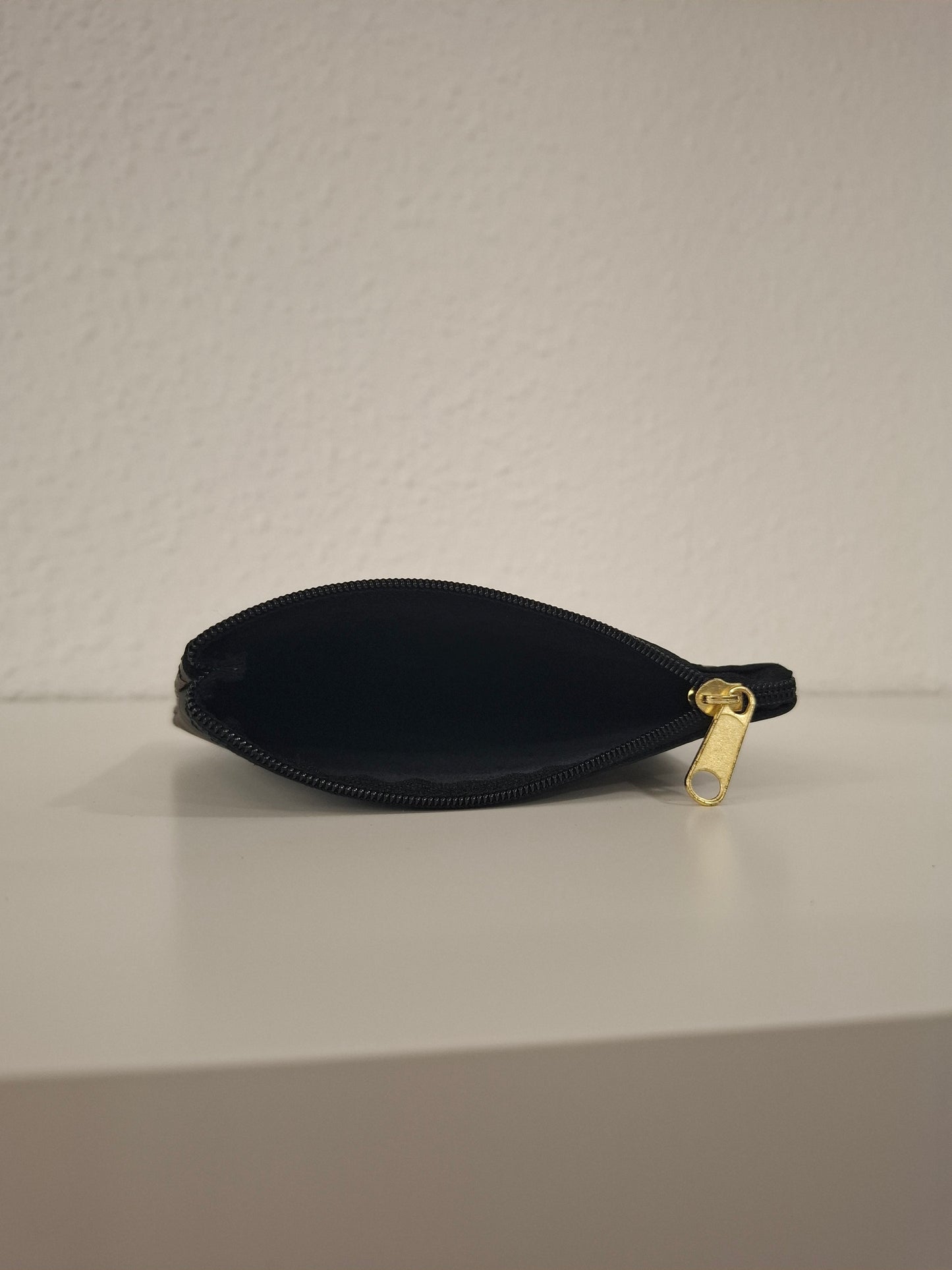 Monedero de piel estampado serpiente brillo cobre y negro