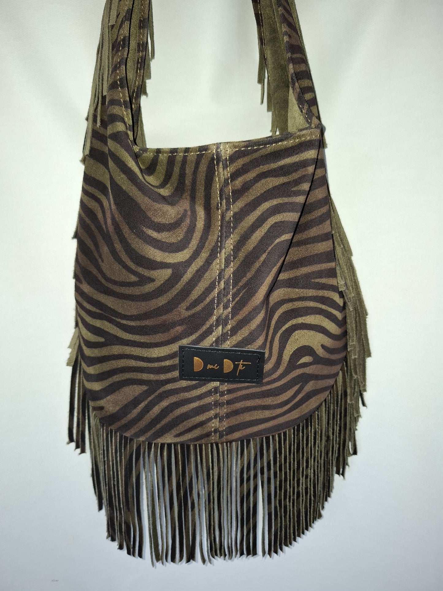 Bolso SOTO serraje flecos estampado cebra