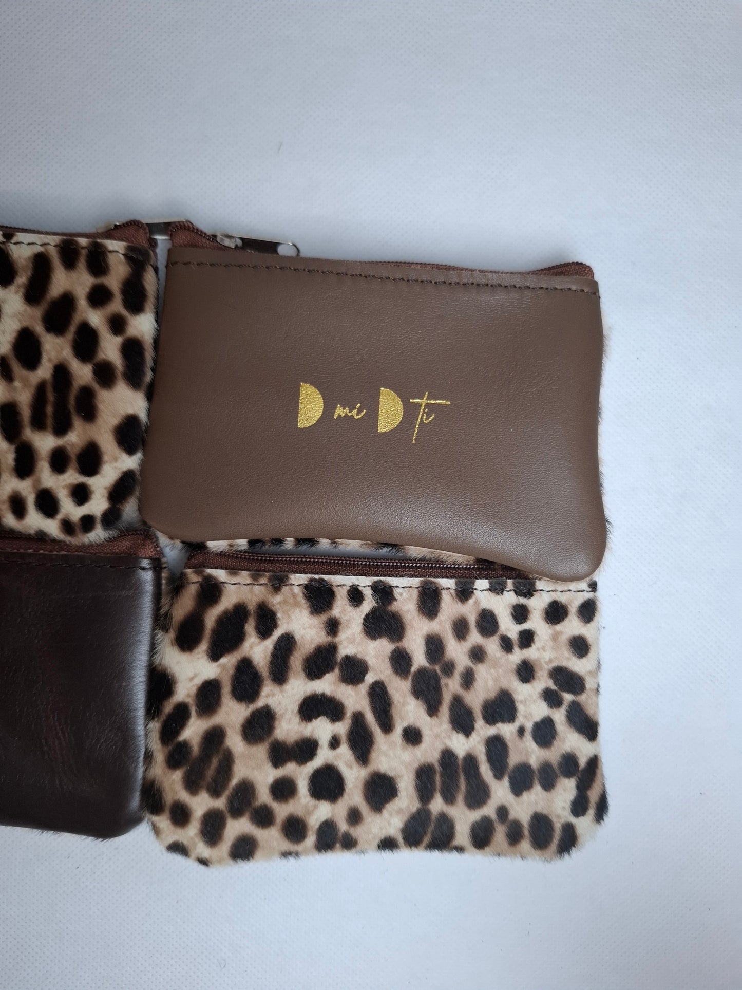 Monedero de piel con pelo print guepardo