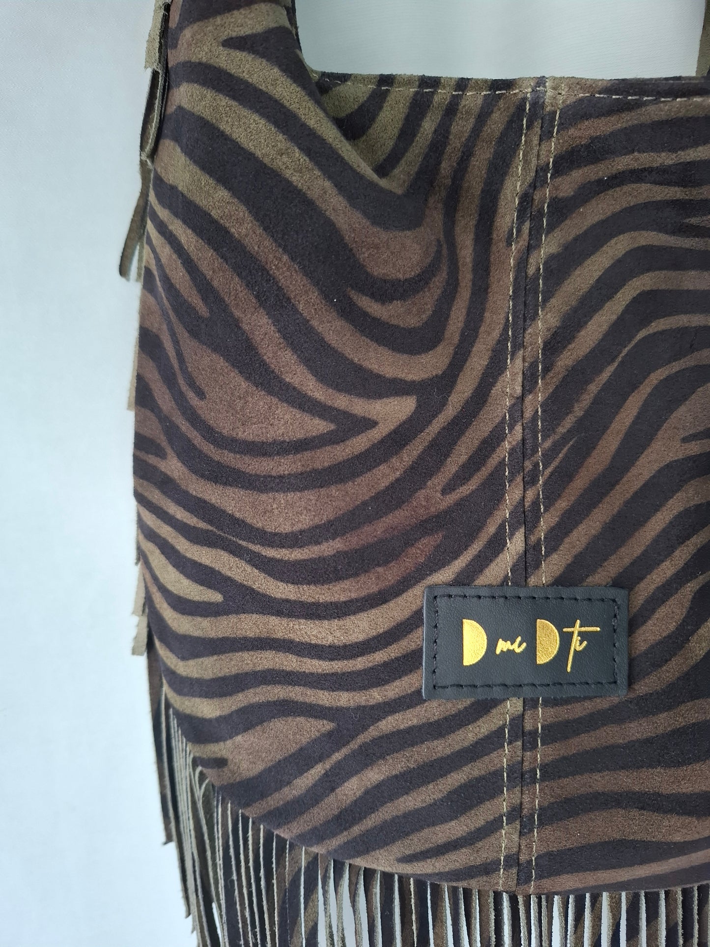 Bolso SOTO serraje flecos estampado cebra