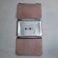 Monedero de piel con pelo rosa y piel plata
