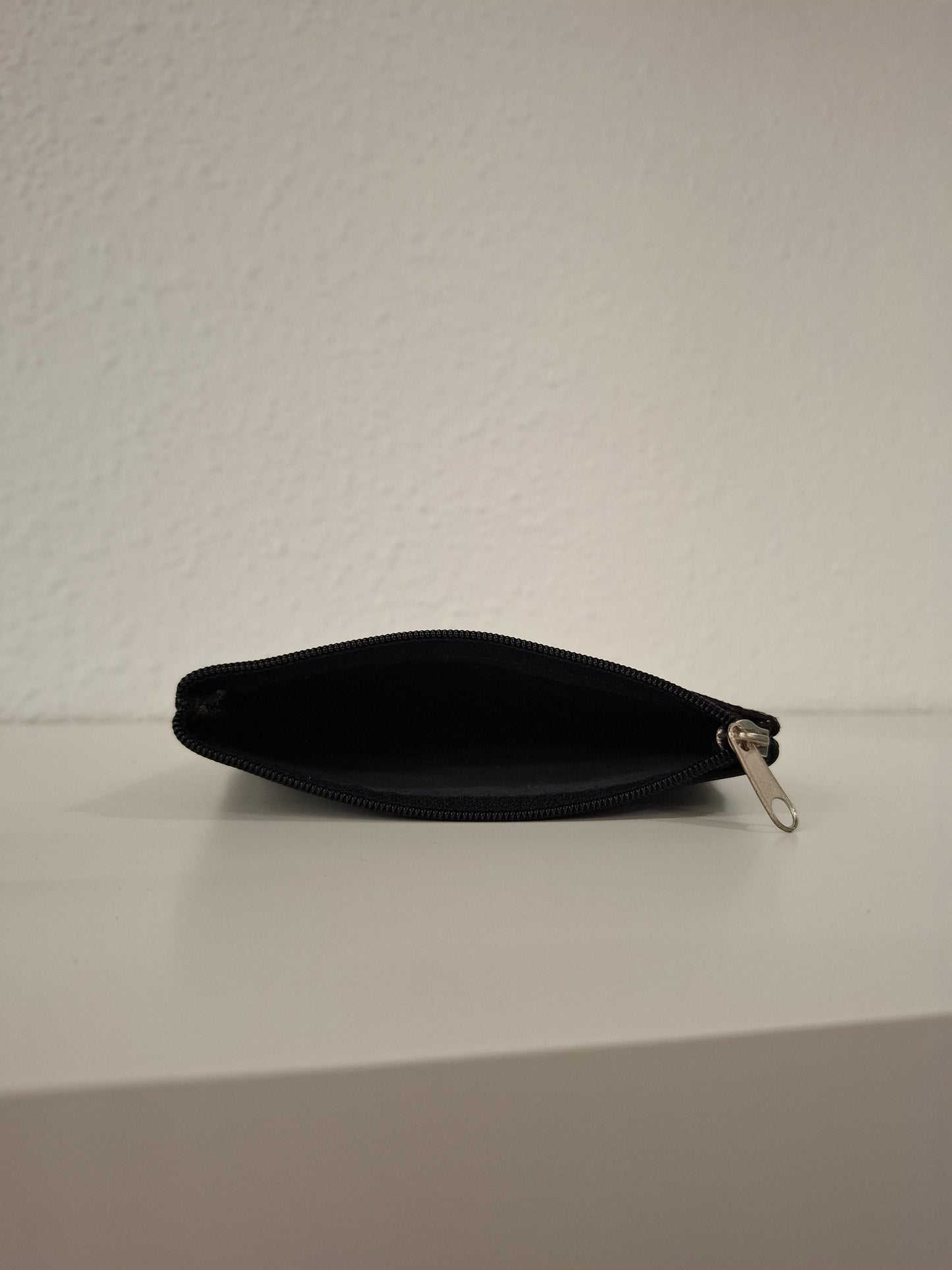 Monedero de piel estampado serpiente negro azul beige