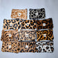 Monedero de piel con pelo animal print grande