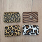 Monedero doble corchete piel con pelo animal print